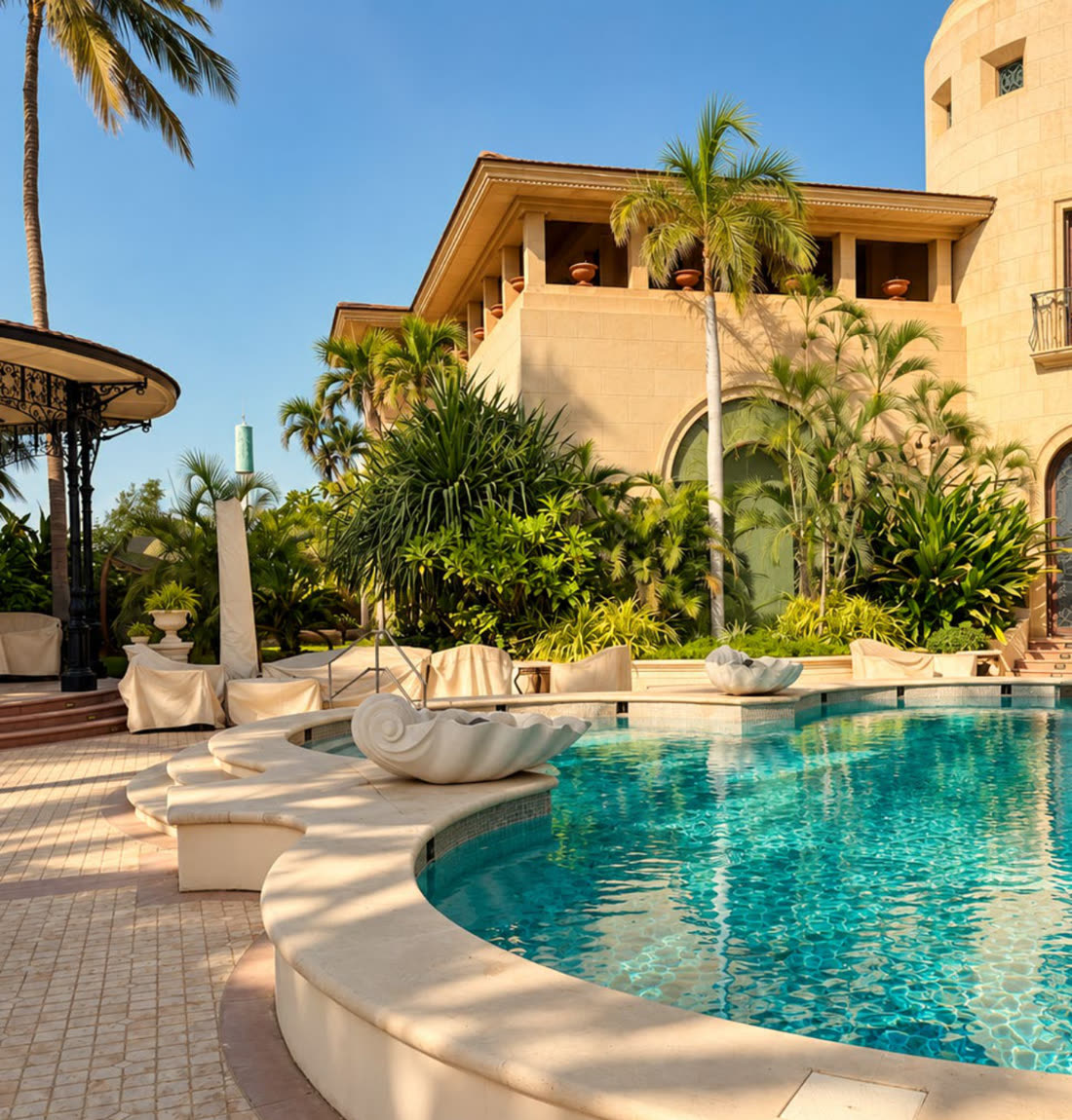A pool terrace framed by palms and planting